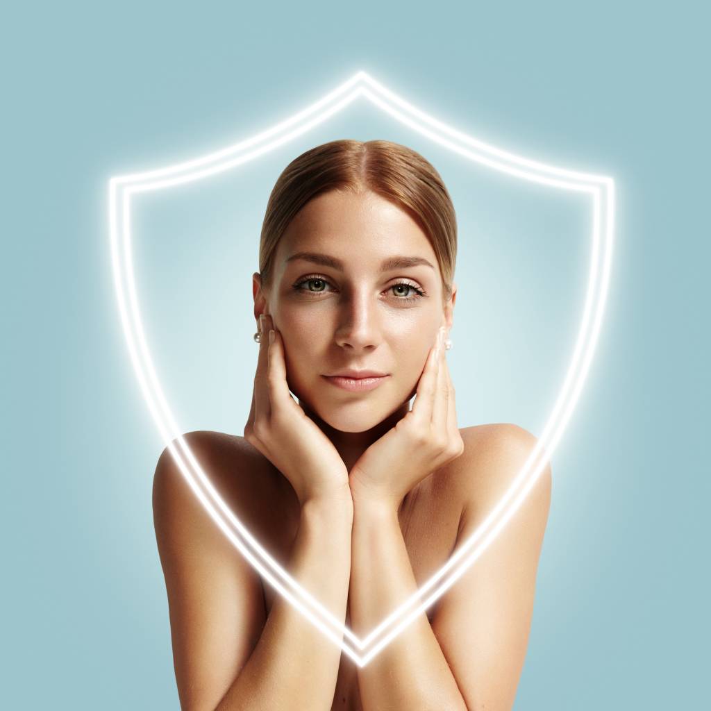 A young women with a golden glow after using DERMAGLOVE products